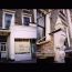 Delicatessen shopfront - New corbel stone, sunken panels & coping - carved and refixed after being hit by a bus: South Kensington, London 2003 (for Stone West Ltd)
